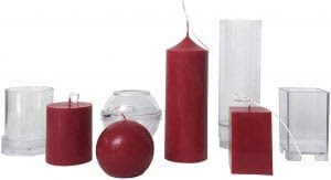Essential candle making equipment: molds, wax, wicks, thermometer, and pouring pitcher