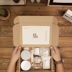 Candle Making Stock Photo Artisan pouring wax into mold, creating handmade candles with care