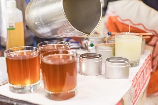 Candle Making Pouring Pots 1 Aluminum candle making pouring pots on a wooden surface, ready for melting wax and pouring