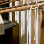 Variety of glass jars and metal lids for candle making supplies